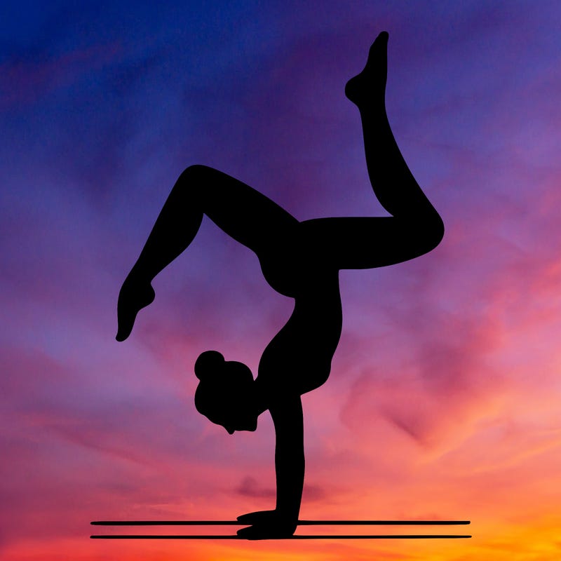 a woman doing a handstand