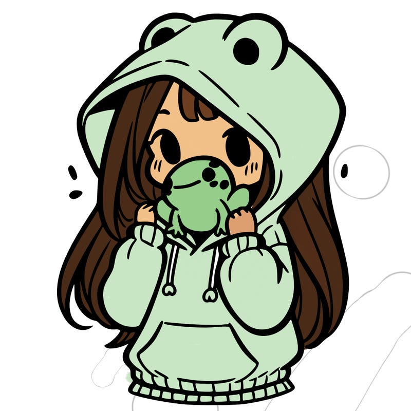 a girl holding a froggy hoodie