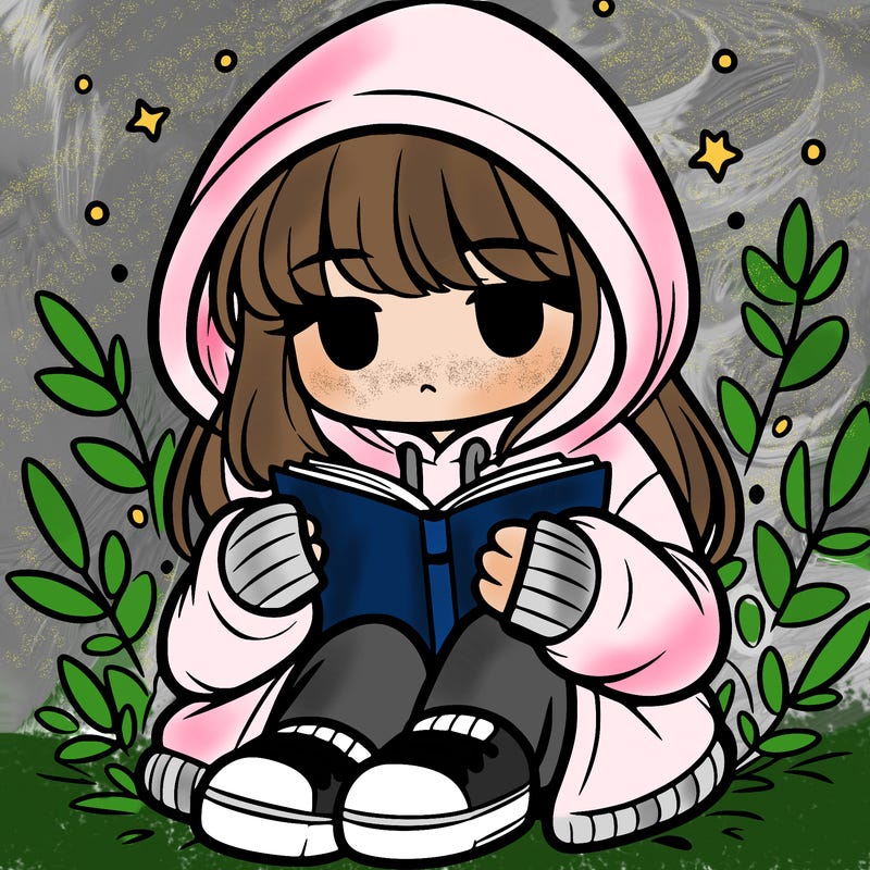girl in oversized hoodie reading a book