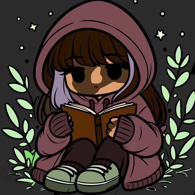 girl in oversized hoodie reading a book