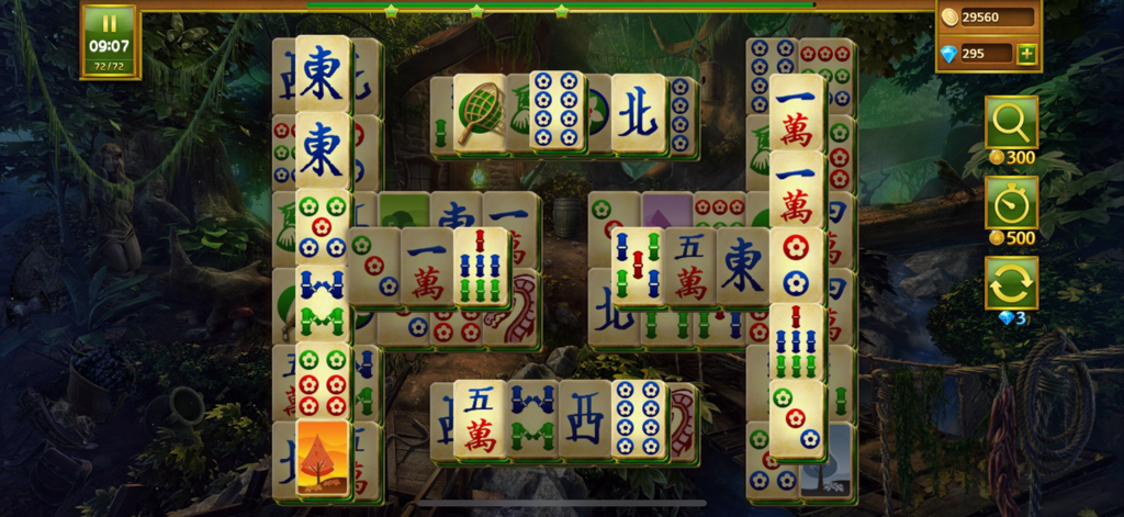 Mahjong Island - Tile Match - Fichas de solitario Mahjong sobre un exuberante fondo de bosque de fantasía en el juego Mahjong Island.
