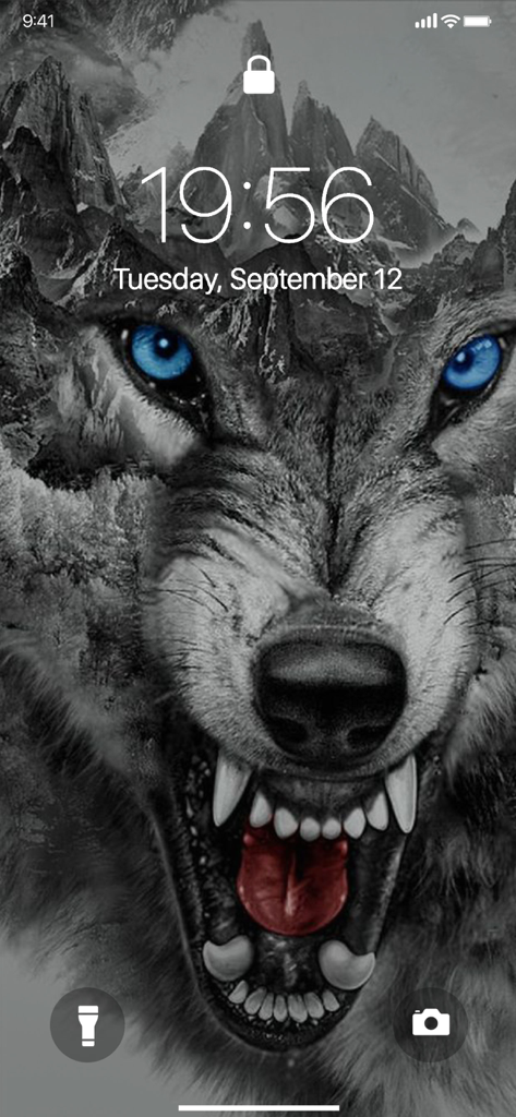 Lone Wolf Wallpapers - Lock screen display of a snarling wolf with bright blue eyes and a mountain background