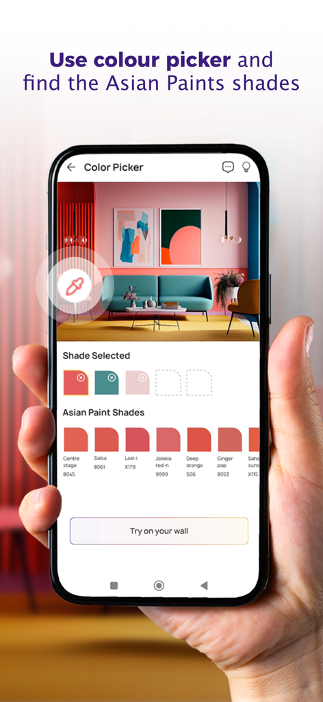 Colour with Asian Paints - A person holding a smartphone using the Asian Paints color picker feature to identify paint shades from a room image.