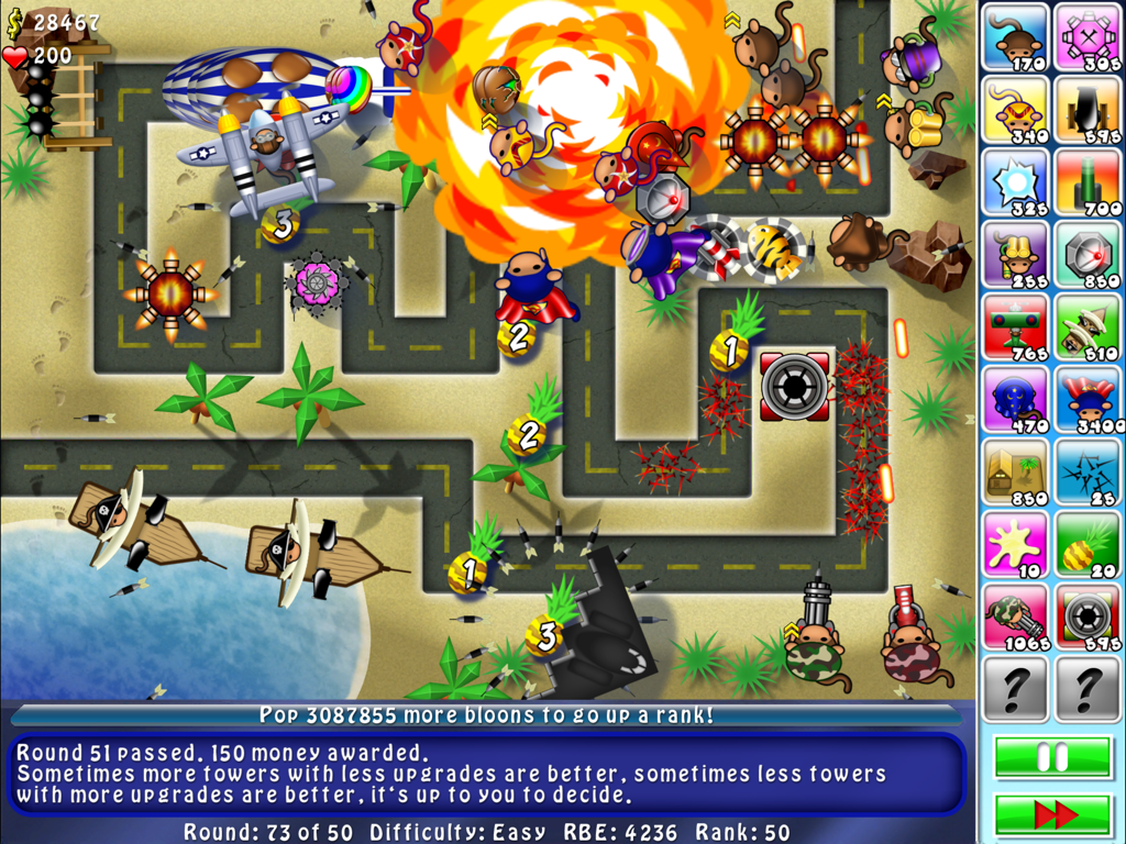 Bloons TD 4 HD gameplay screenshot showing monkey towers defending a track with explosions