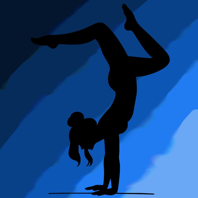 a woman doing a handstand