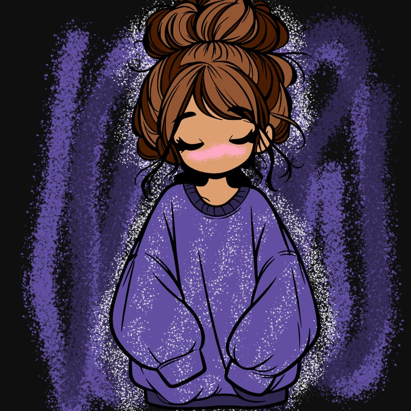 girl with baggy sweatshirt and messy bun