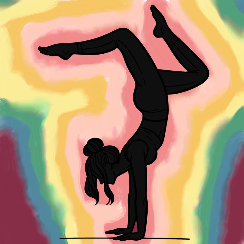 a woman doing a handstand