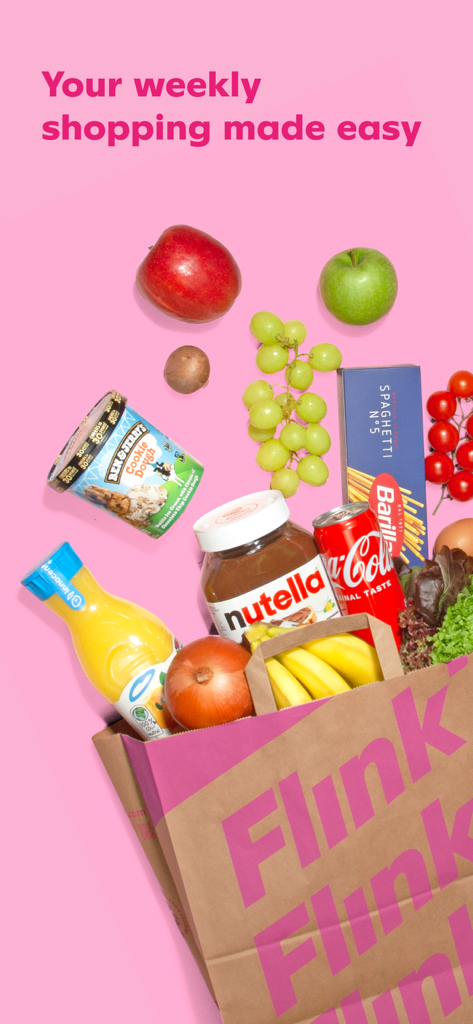 A pink Flink grocery bag filled with fresh produce and snacks on a pink background
