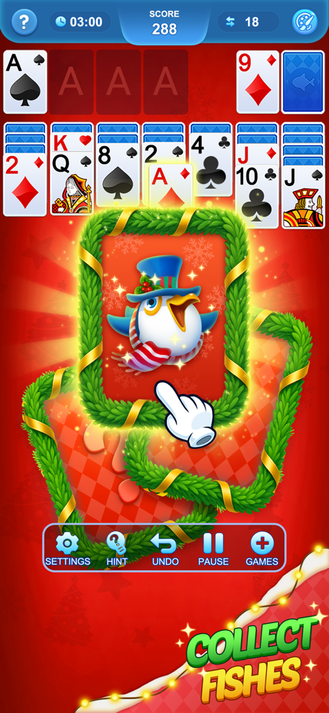 Solitaire 3D Fish gameplay screenshot featuring a holiday theme with a festive penguin card and collect fishes call to action.