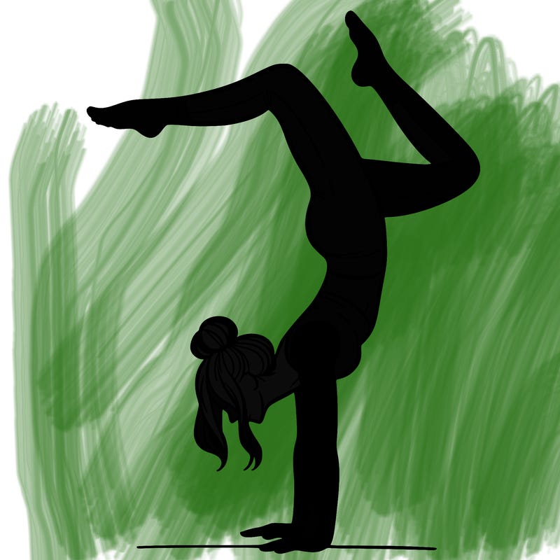 a woman doing a handstand