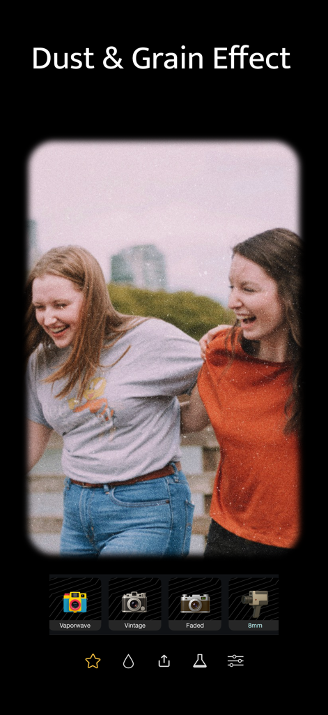 Vintage Camera: Analog Film - Vintage Camera app showing dust and grain effects on a retro photo of two friends