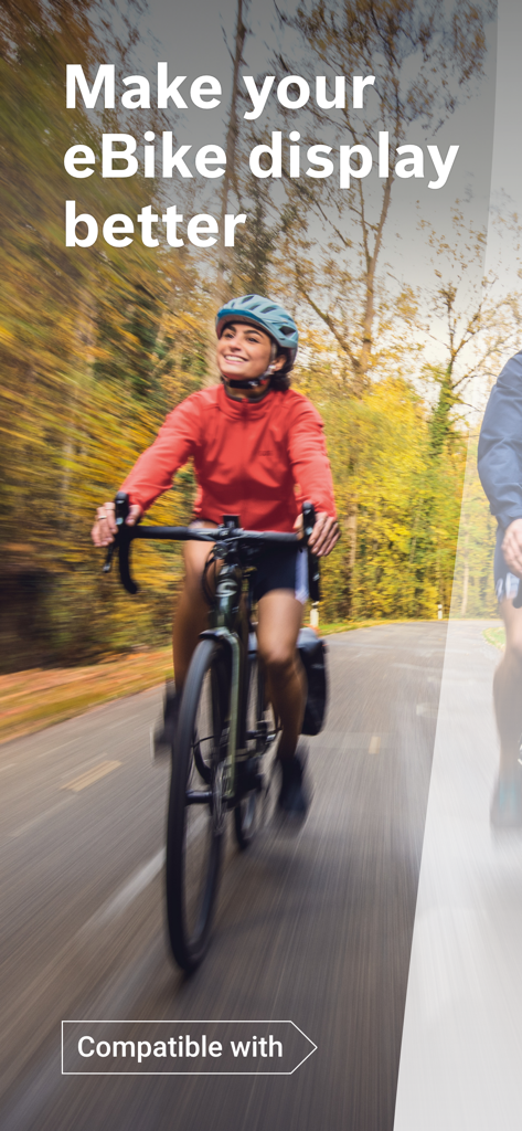 Bosch eBike Connect - A woman smiling while riding an e-bike on a wooded road.