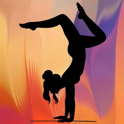 a woman doing a handstand