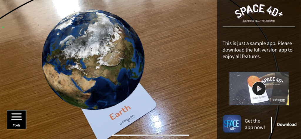 4D+ - An augmented reality 3D Earth globe appearing above a Space 4D+ flashcard.