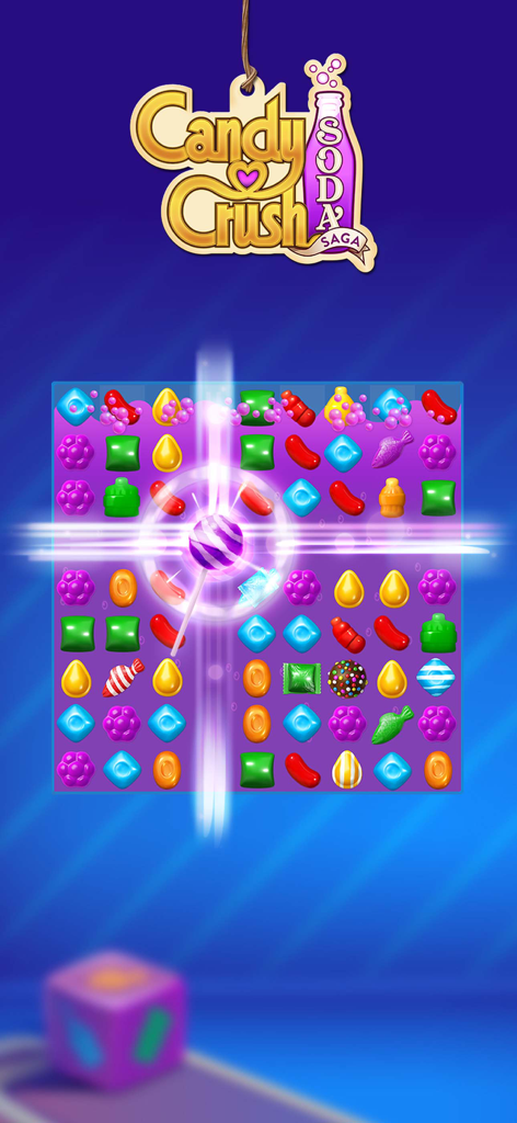 Candy Crush Soda Saga - Gameplay screenshot of Candy Crush Soda Saga showing a Lollipop Hammer booster activating on a grid of colorful candies.