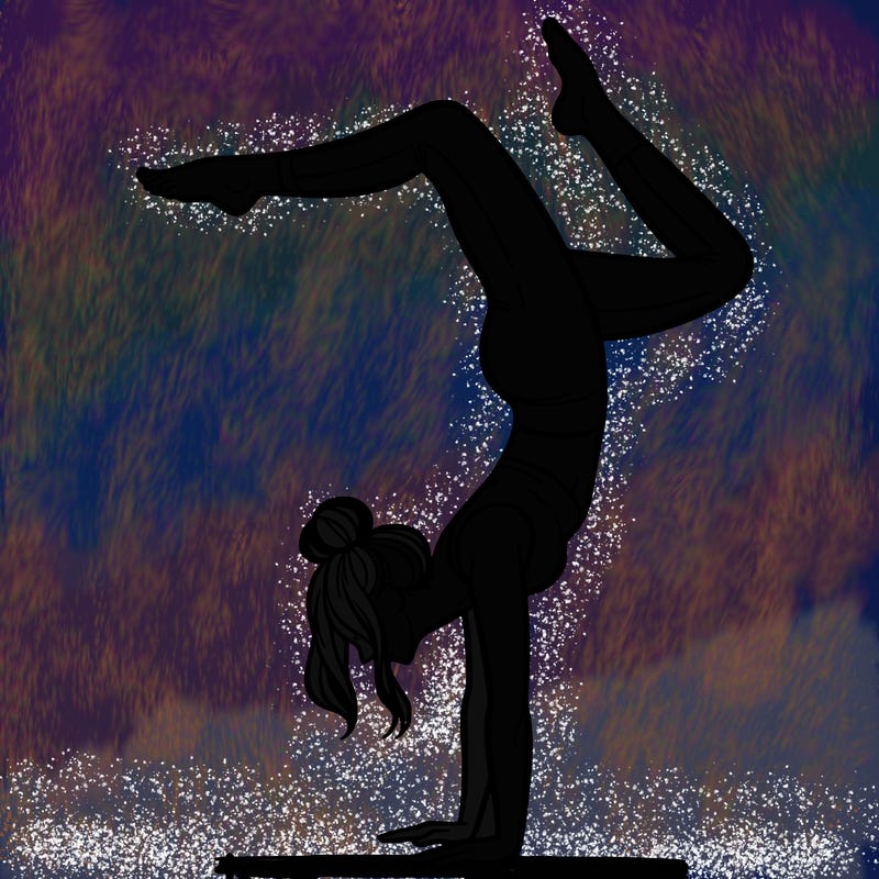 a woman doing a handstand