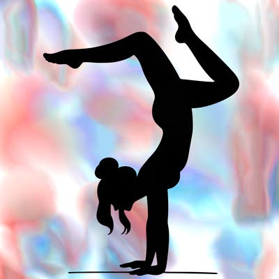 a woman doing a handstand