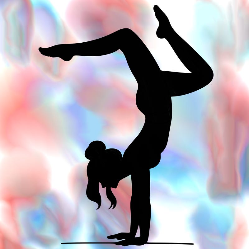 a woman doing a handstand