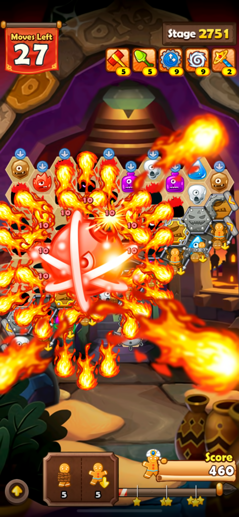 Monster Busters: Hexa Blast - A massive red bomb exploding with fire on a hexagonal match three puzzle board in Monster Busters Hexa Blast