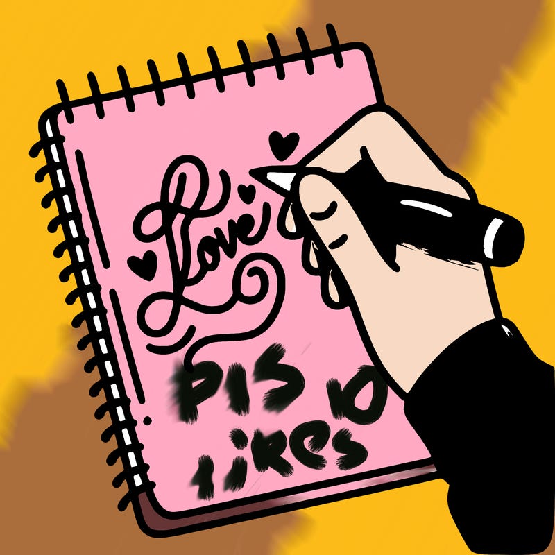 a hand writing “love” in calligraphy on a notebook