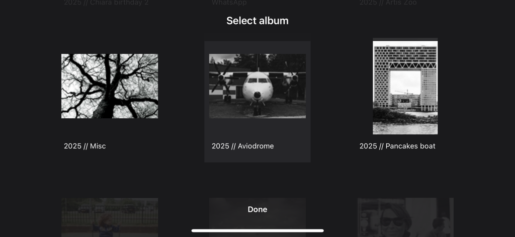 FotoSlide interface showing a curated list of photo albums to choose from for a digital slideshow