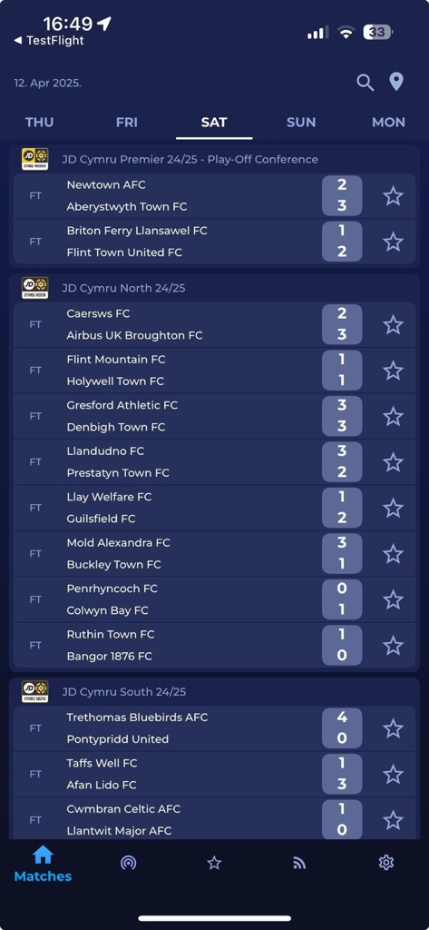 Cymru Football app displaying match scores and results for various Welsh football leagues including the JD Cymru Premier North and South