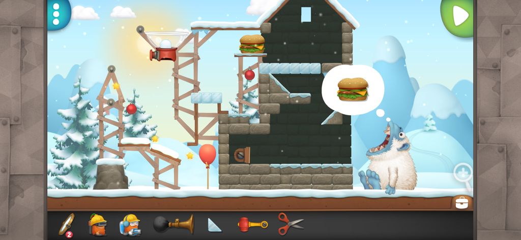 Inventioneers - Gameplay of Inventioneers showing a winter themed physics puzzle to feed a yeti.