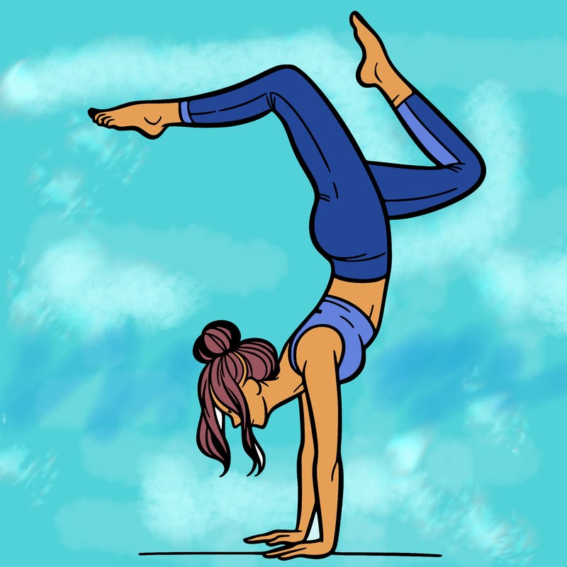 a woman doing a handstand