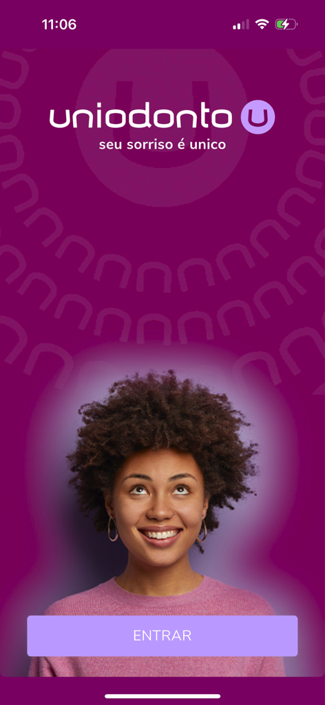 Uniodonto Beneficiário - Uniodonto Beneficiário app login screen with a smiling woman and a purple background.