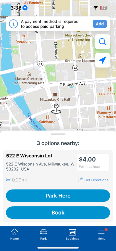 Secure-a-Spot app interface showing a map of Milwaukee with a nearby parking lot selection at 522 E Wisconsin Lot for 4 dollars
