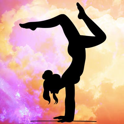 a woman doing a handstand