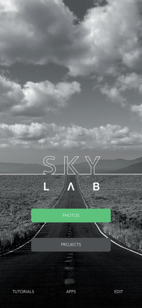 SkyLab Photo Editor - The home screen of the SkyLab Photo Editor app showing buttons for Photos and Projects over a dramatic black and white landscape.