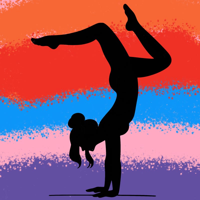 a woman doing a handstand
