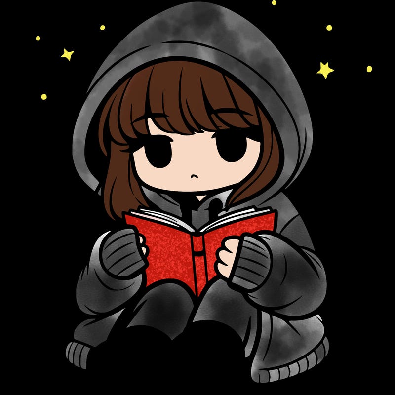 girl in oversized hoodie reading a book