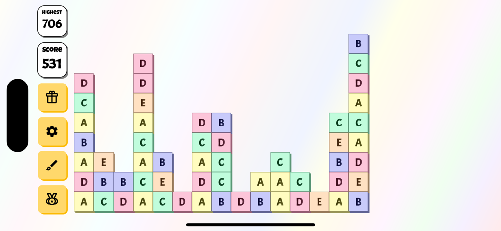 ABCDE Game - Gameplay of ABCDE Game showing a colorful grid of letter tiles with score and high score counters