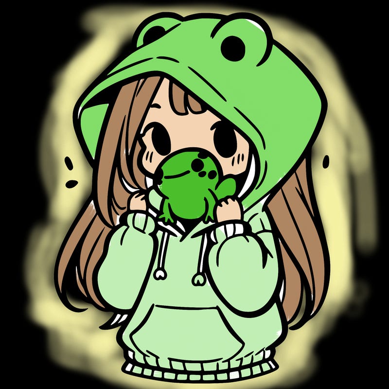 a girl holding a froggy hoodie