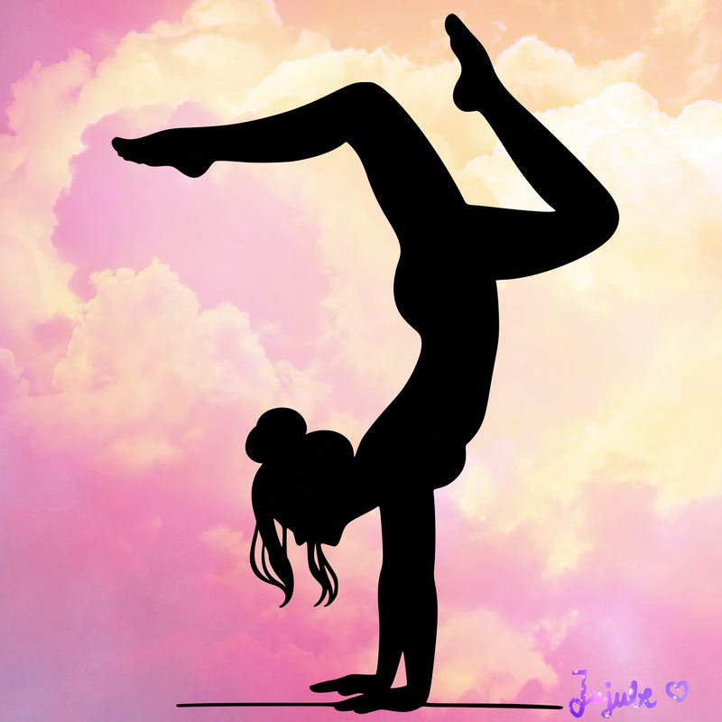 a woman doing a handstand