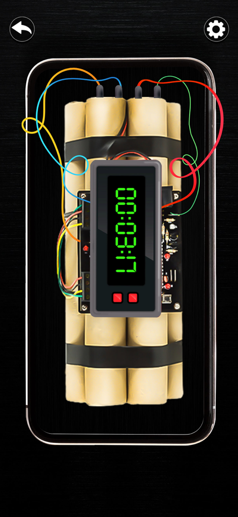 Un timer digitale con conto alla rovescia su un pacco di dinamite con fili colorati per uno scherzo.