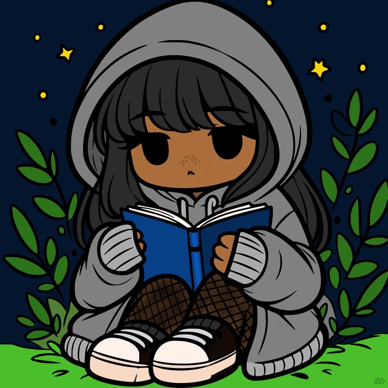 girl in oversized hoodie reading a book
