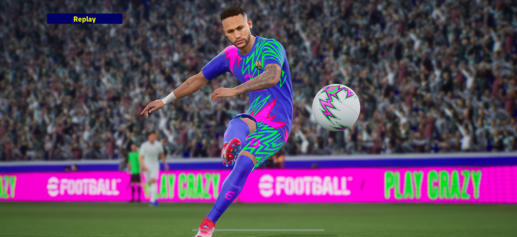 A soccer player in a neon jersey kicks a ball in a packed stadium in eFootball