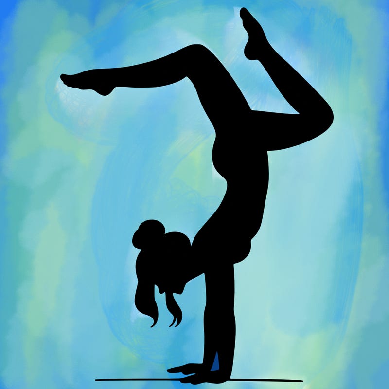 a woman doing a handstand
