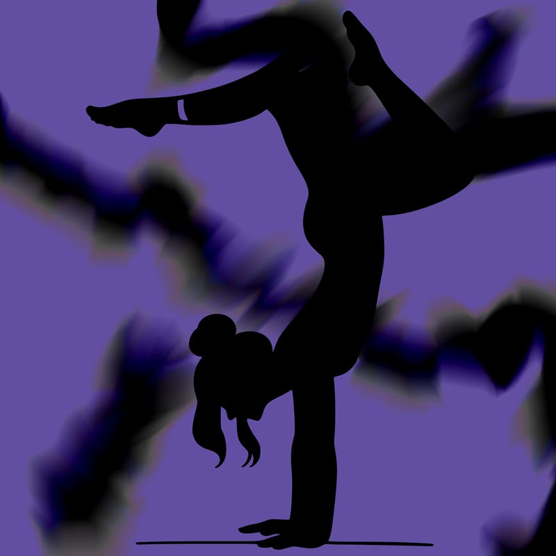 a woman doing a handstand