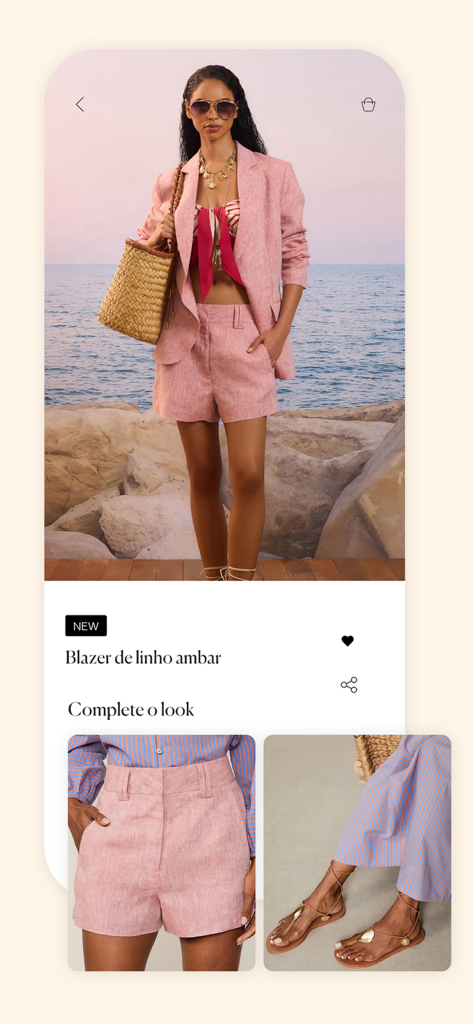 Animale - Moda Feminina - Uma modelo mostrando um conjunto de blazer e shorts de linho rosa no aplicativo de compras móveis da Animale.