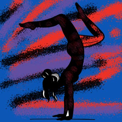 a woman doing a handstand