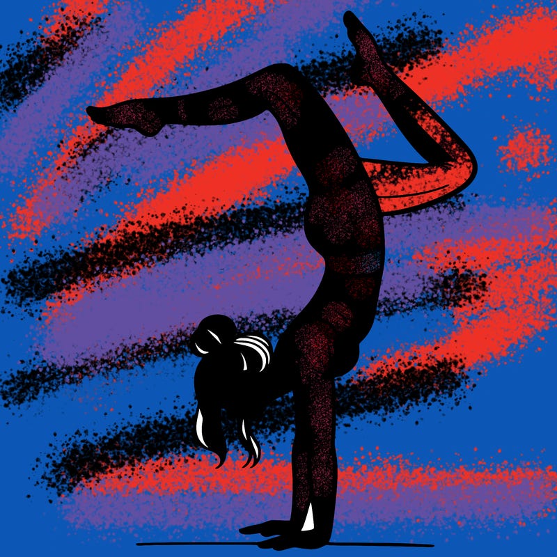 a woman doing a handstand