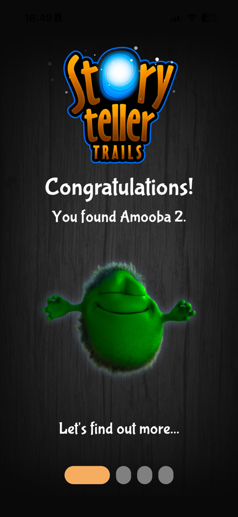 Storyteller Trails - Tela de parabéns do Storyteller Trails com um personagem verde sorridente chamado Amooba 2.