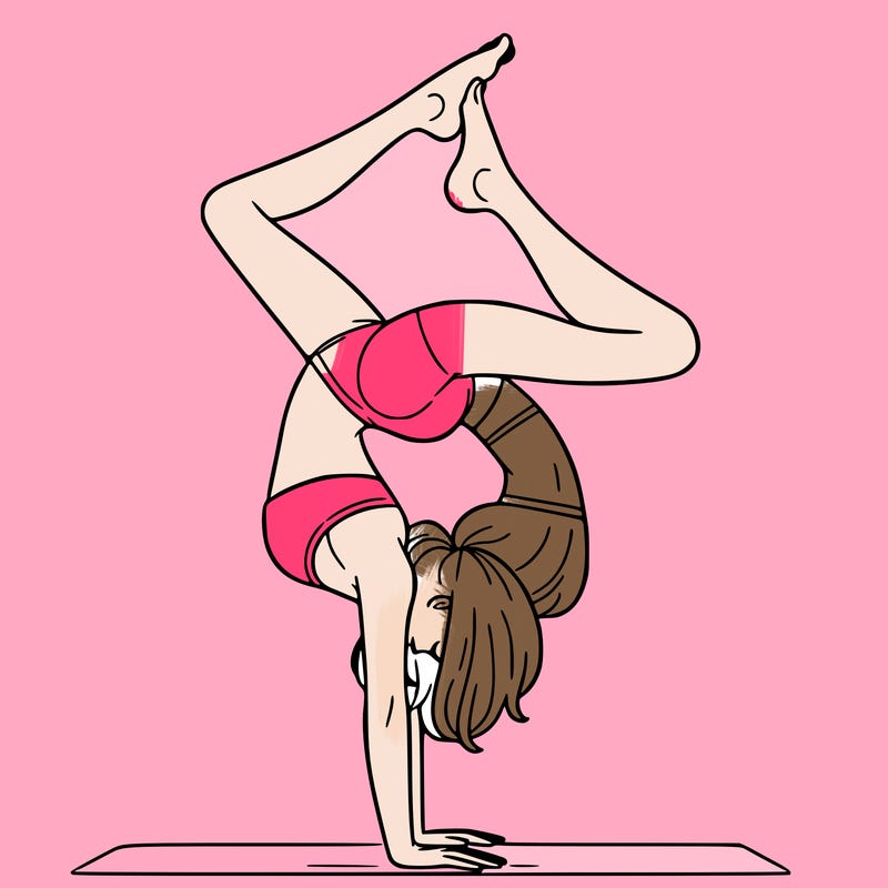 a woman doing a handstand