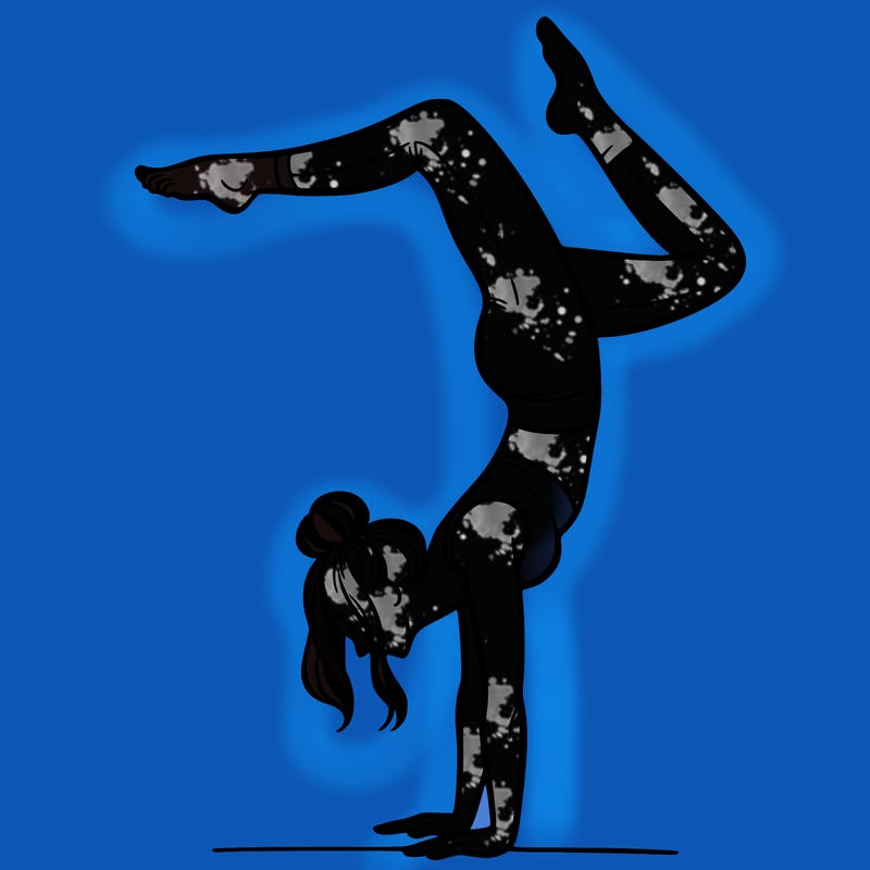 a woman doing a handstand