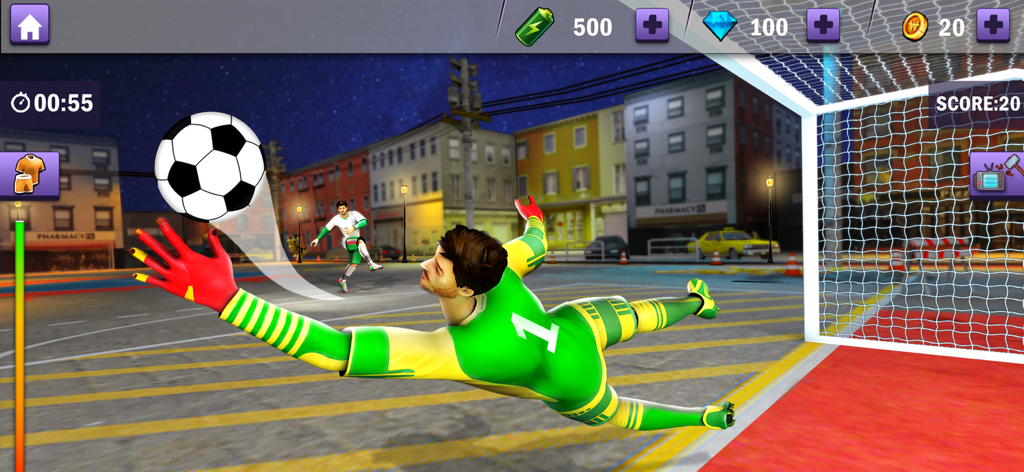 Real Soccer – Football Games - ストリートフットボールのピッチでサッカーボールをセーブするためにダイビングする緑のキットを着たゴールキーパー。