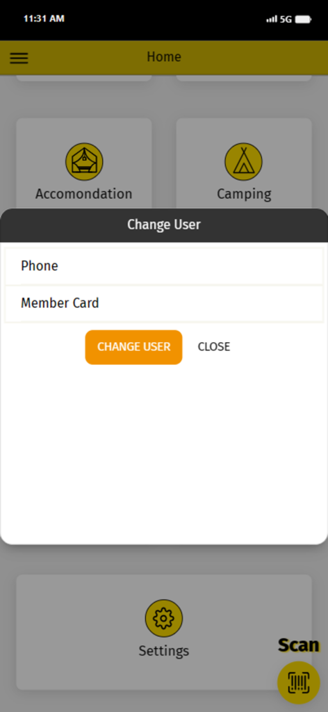 Armenistis - Una pantalla de aplicación móvil que muestra una ventana emergente de cambio de usuario con opciones de teléfono y tarjeta de miembro sobre el menú de inicio
